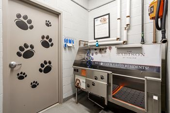 a machine in a room with paw prints on the door